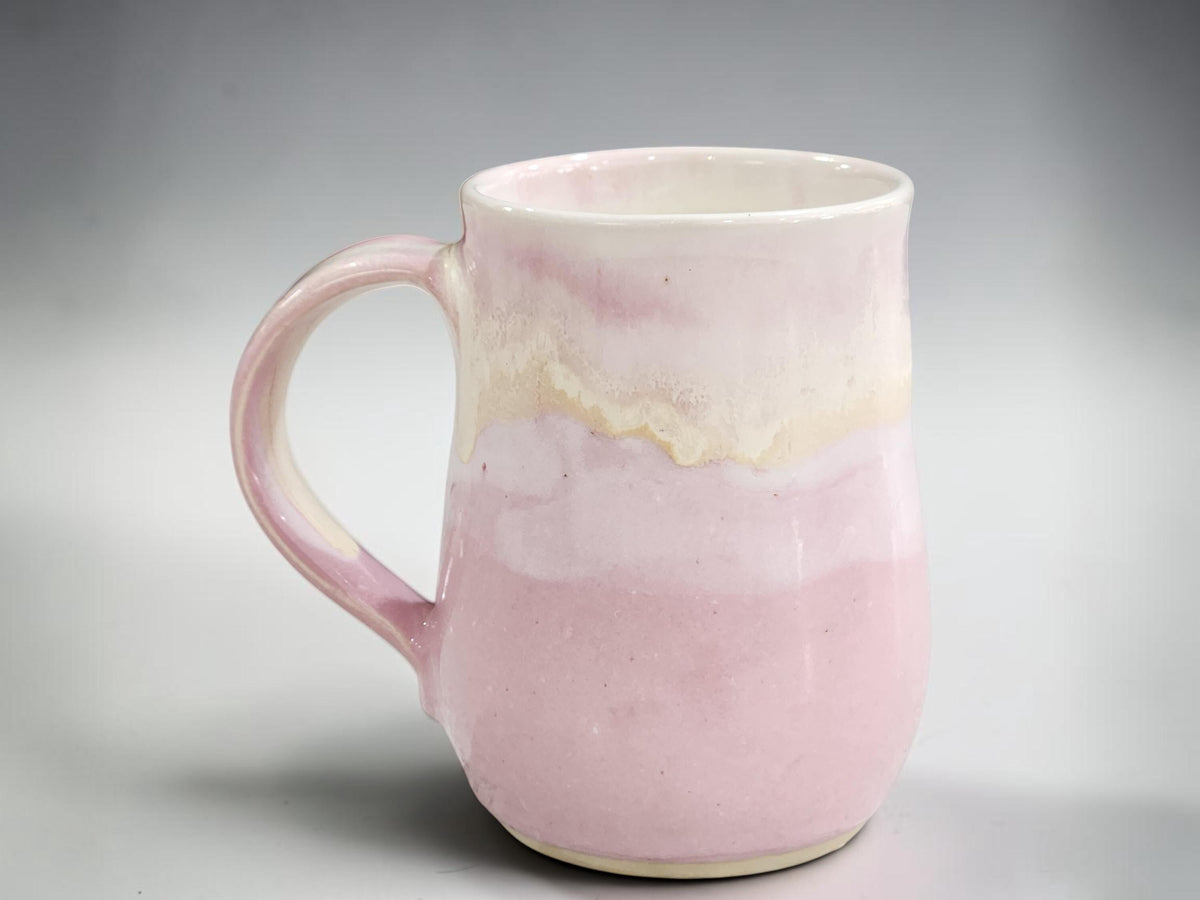 Australian handmade pottery mug in soft blush pink and cream glaze