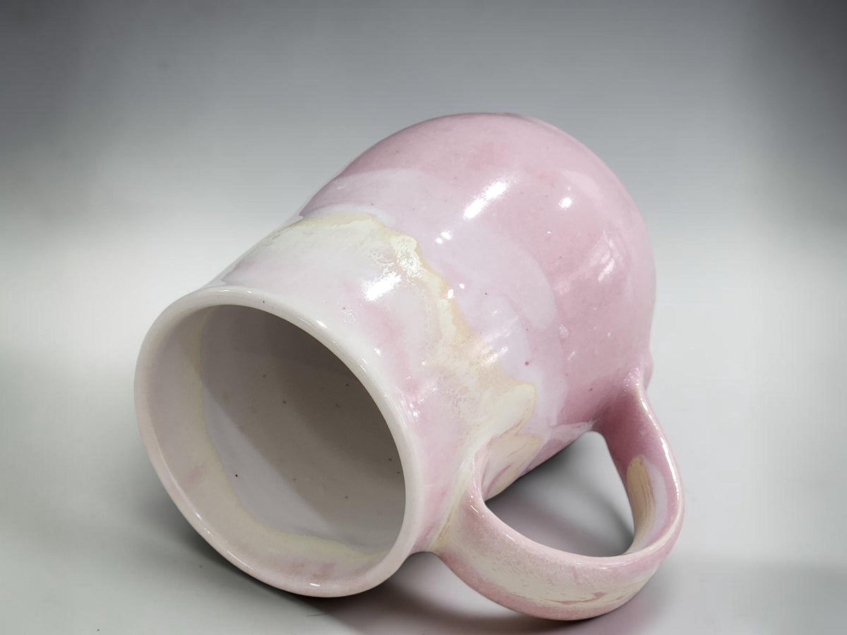 Handmade ceramic coffee mug in soft pink glaze, unique Australian gift idea