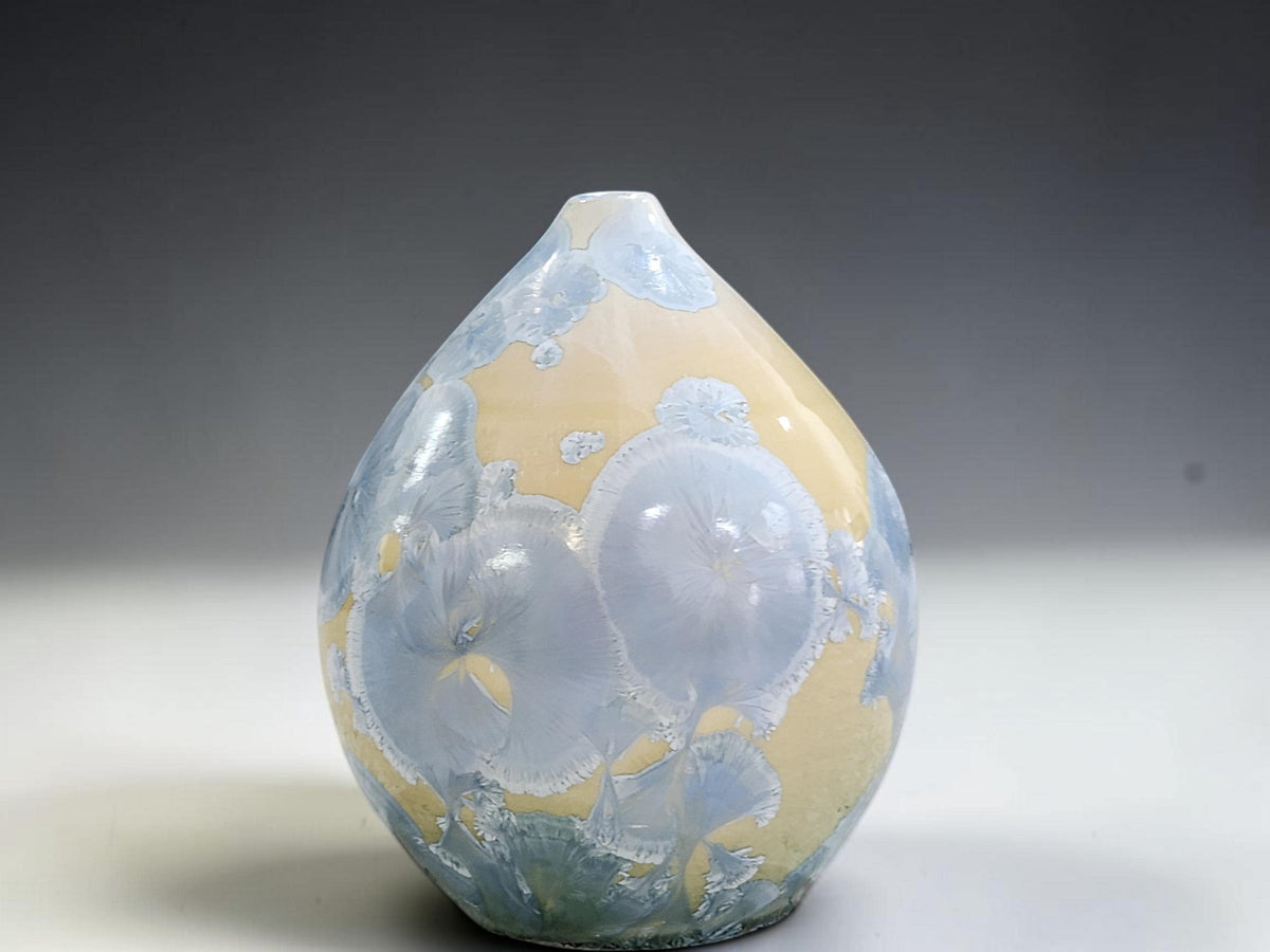 Alternate view of the small crystalline pot showing the changing glaze pattern around its body.