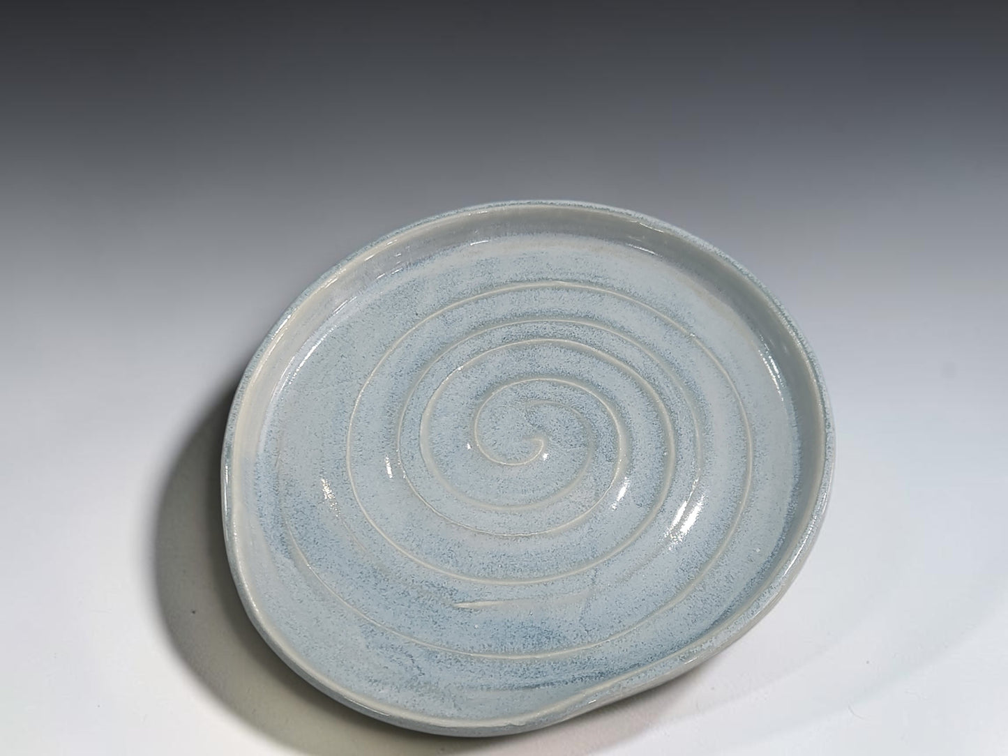 Soft blue grey ceramic spoon rest measuring approximately 15cm across