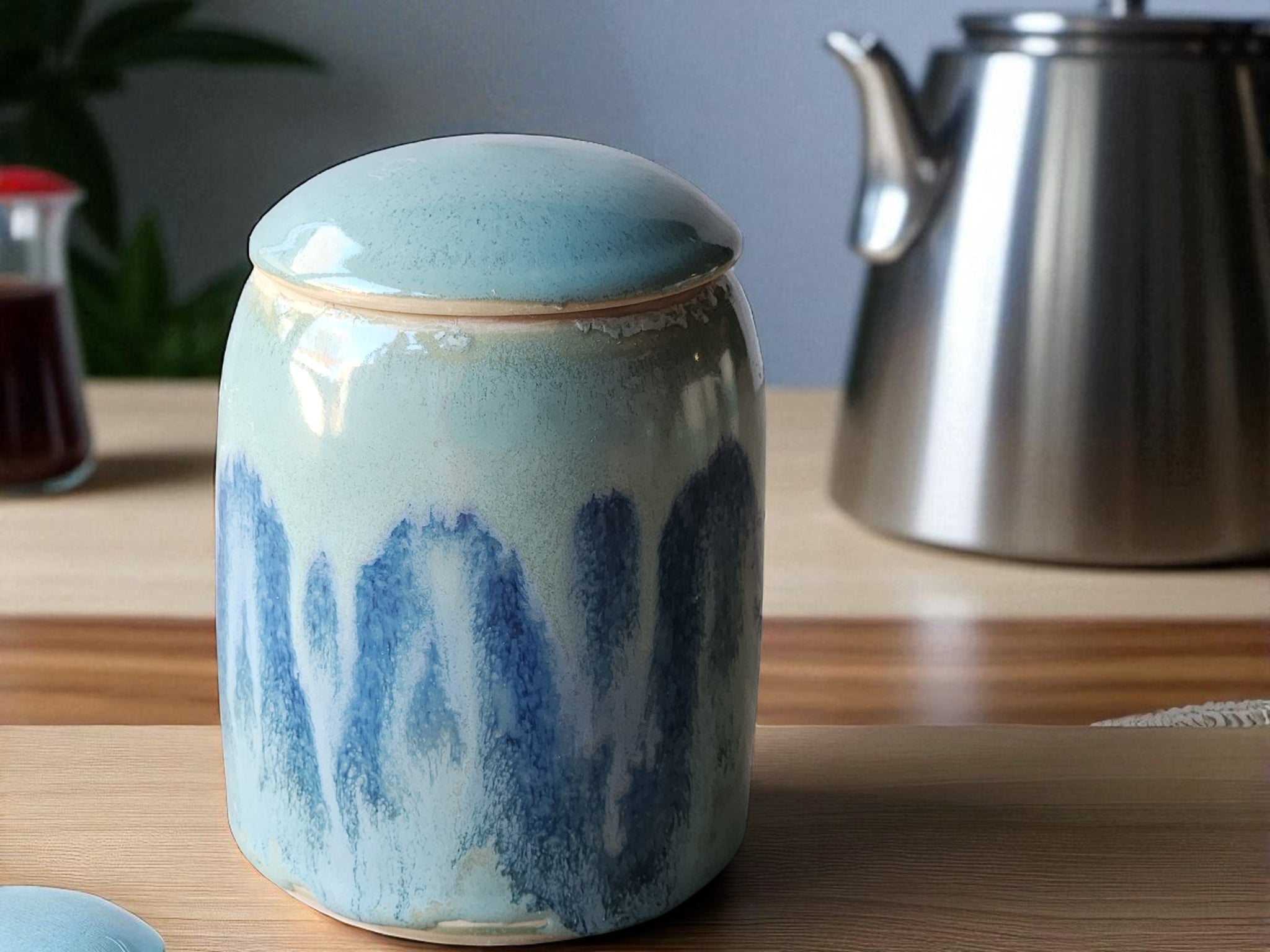 Handmade Pottery Lidded Jar | Ocean Blue & Green Ceramic Canister on a timber bench