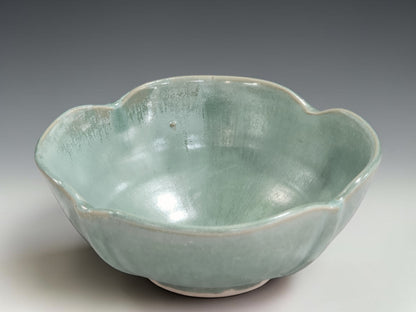 Australian handmade ceramic bowl with seafoam green glaze and sculptural petal-like rim