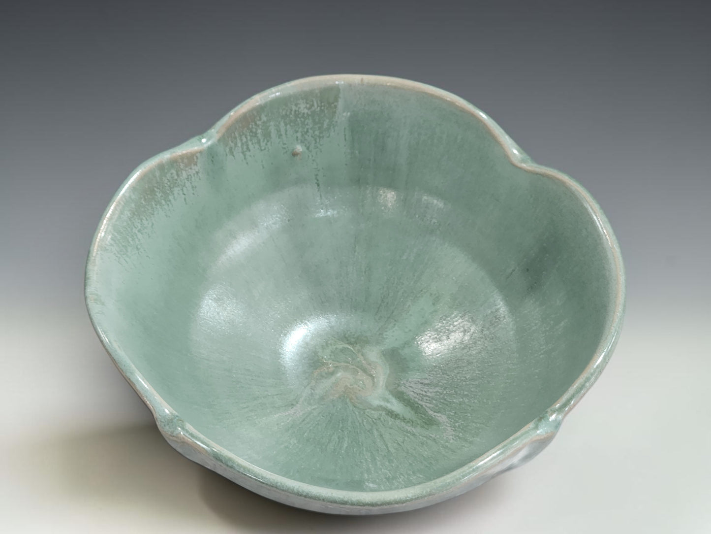 Handmade ceramic serving bowl in soft green glaze, made in Melbourne pottery studio