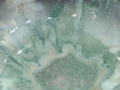 Close-up of Bush Creek Mist flowing glaze inside handmade stoneware bowl