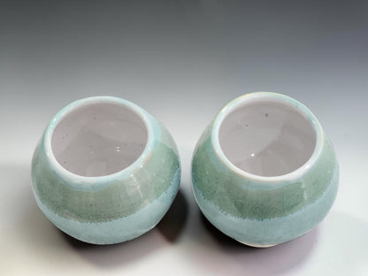 Japanese-inspired stoneware tea cups handmade in Melbourne, featuring layered green glazes that create unique organic variations.
