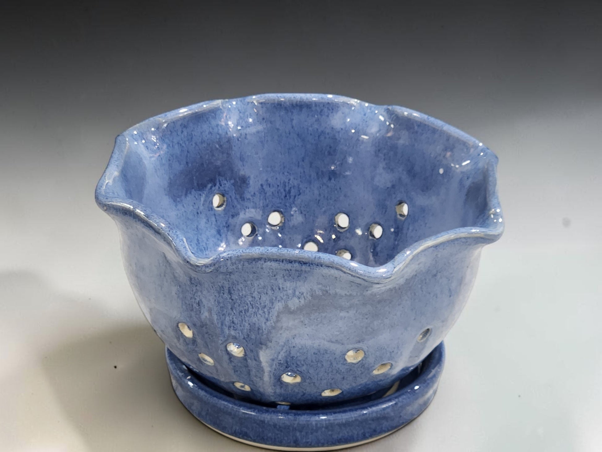 Australian handmade pottery berry bowl in ocean blue glaze with matching plate