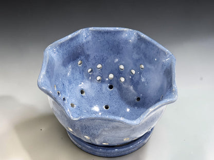 Handmade fruit rinsing bowl with pierced holes and matching saucer