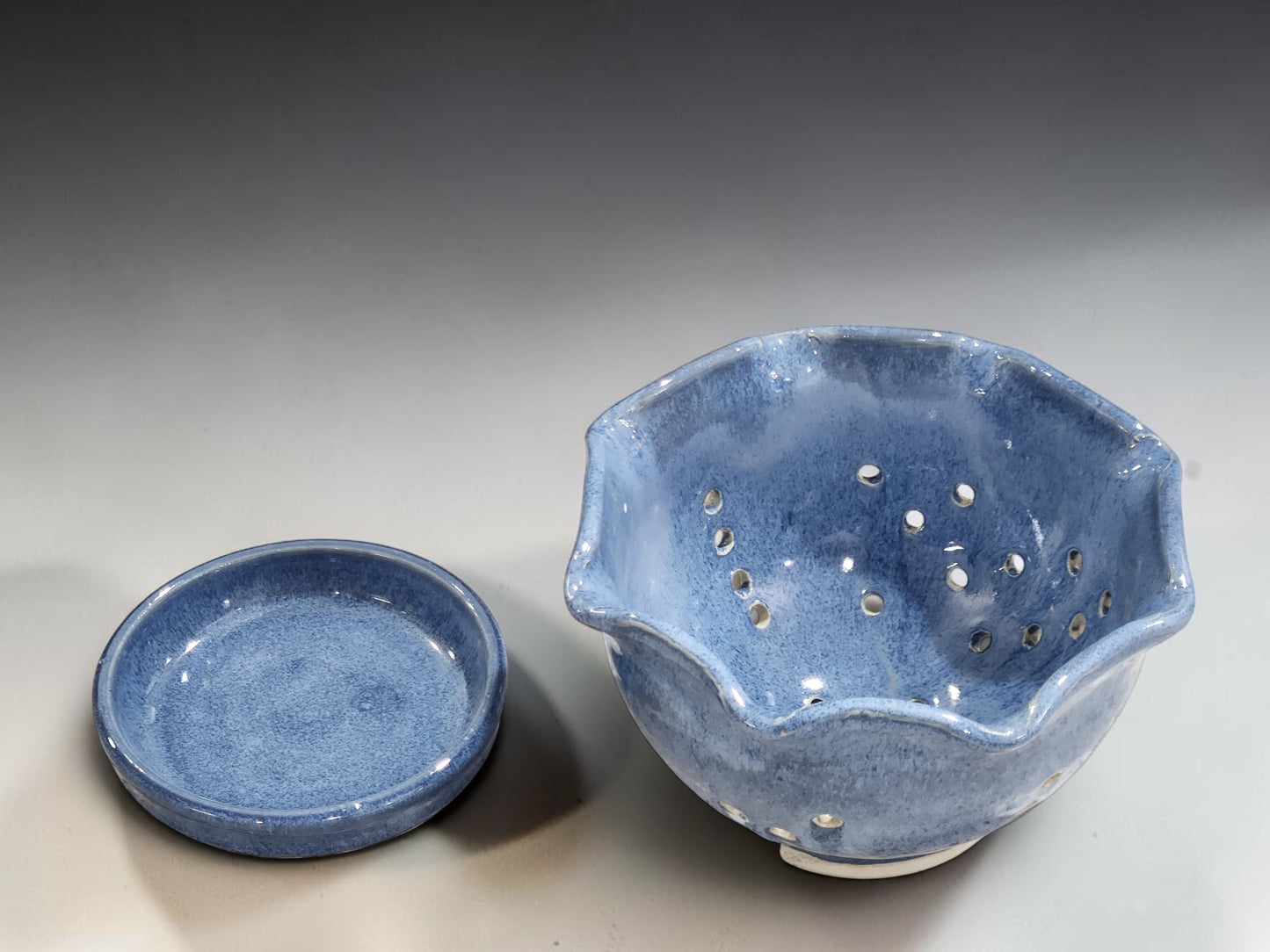 Blue stoneware berry bowl for rinsing and serving strawberries blueberries and raspberries