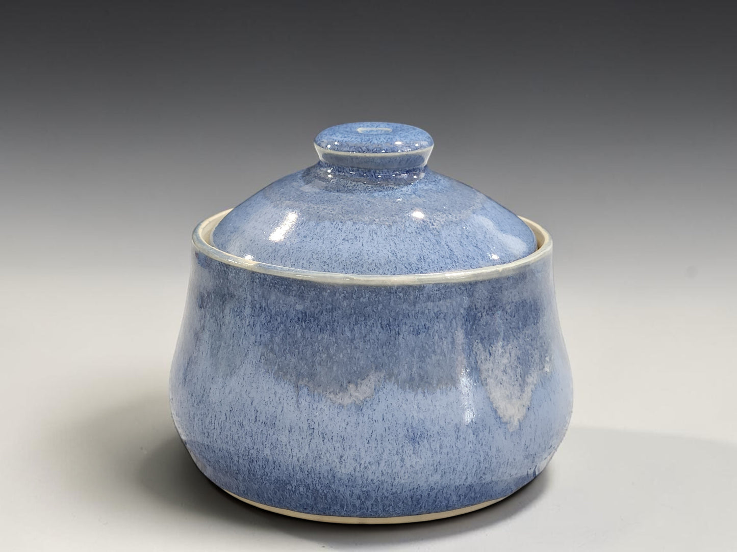 Handmade ceramic sugar bowl with lid in mottled blue glaze