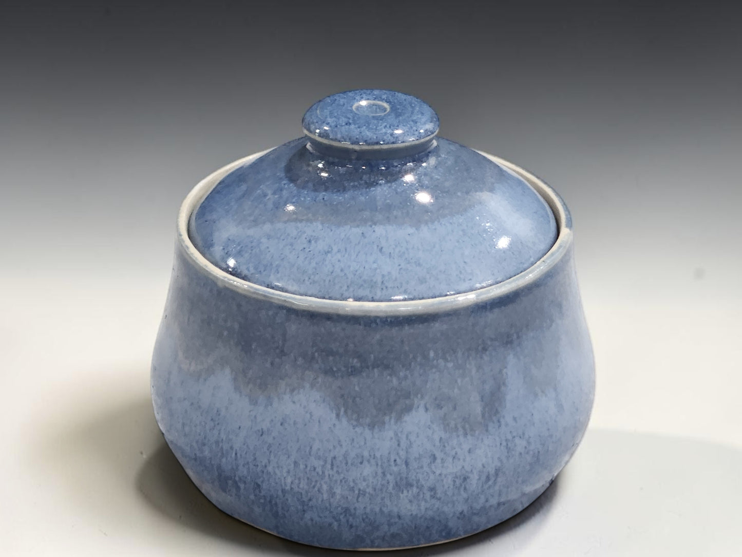 Small ceramic lidded bowl in glossy blue glaze handmade in Melbourne