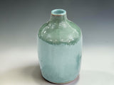Australian handmade pottery oil bottle with elegant green glaze, combining practical food storage with artisan ceramic craftsmanship.