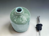 Handmade ceramic olive oil bottle by Buxton Pottery, featuring organic glaze variations and a timeless contemporary form.