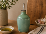 Handmade mottled green ceramic oil bottle by Buxton Pottery, 400ml stoneware olive oil dispenser handcrafted in Melbourne, Australia, combining artisan craftsmanship with functional kitchen design.