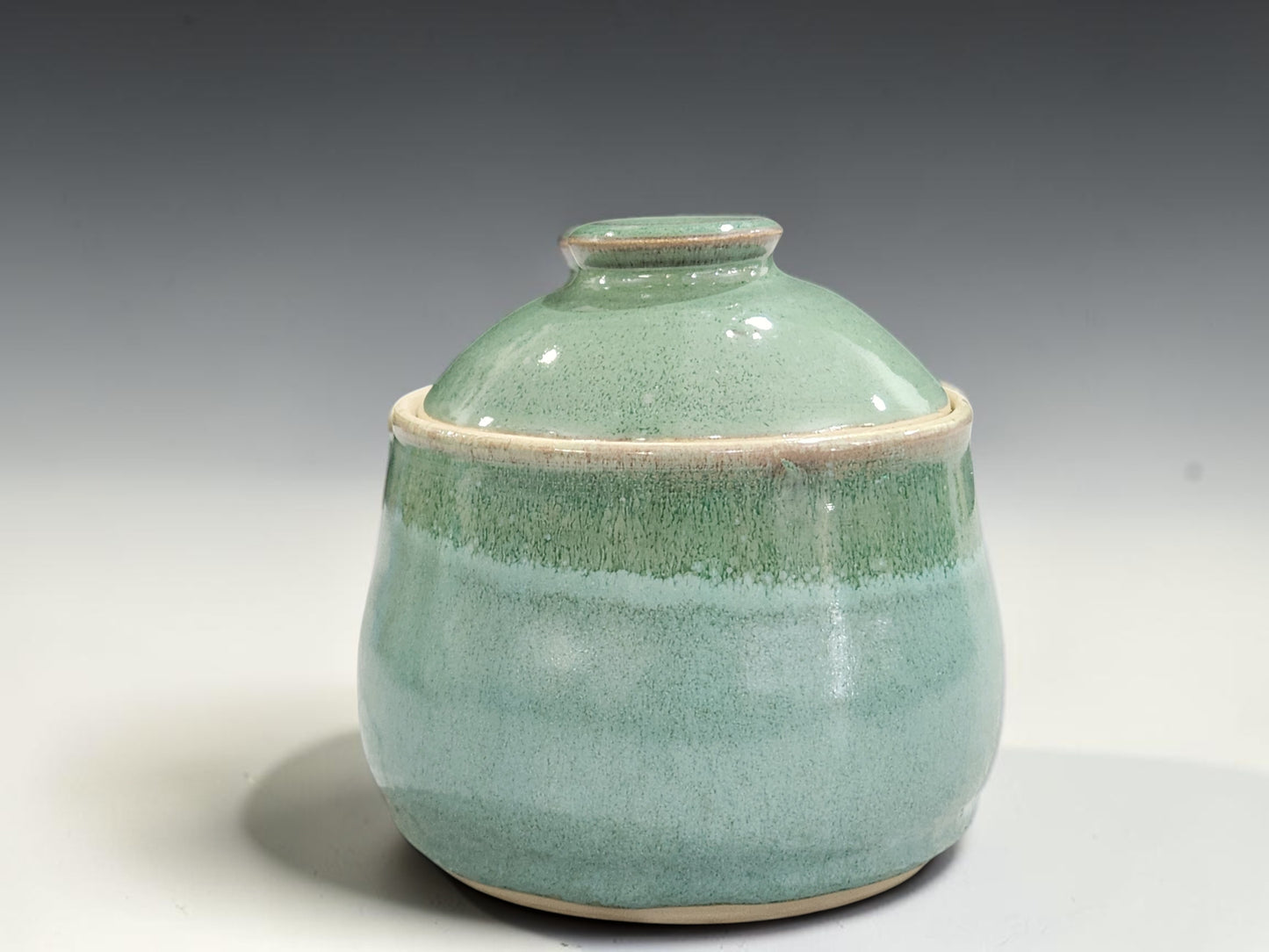 Handmade spearmint green pottery sugar bowl with fitted lid