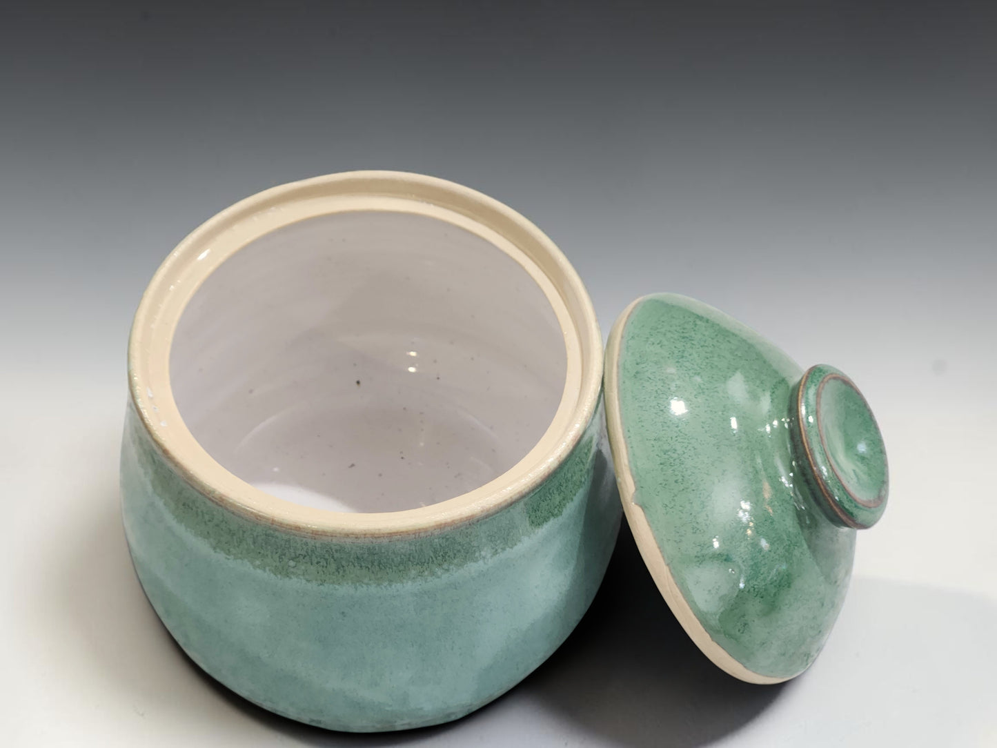 Spearmint green ceramic sugar bowl with rounded lid and knob