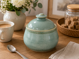 Handmade ceramic sugar bowl with lid by Buxton Pottery, artisan pottery handcrafted in Melbourne, Australia, featuring a soft sage green glaze and timeless functional design.