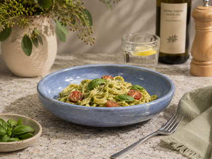 Handmade blue stoneware pasta bowl by Buxton Pottery filled with fresh pesto pasta