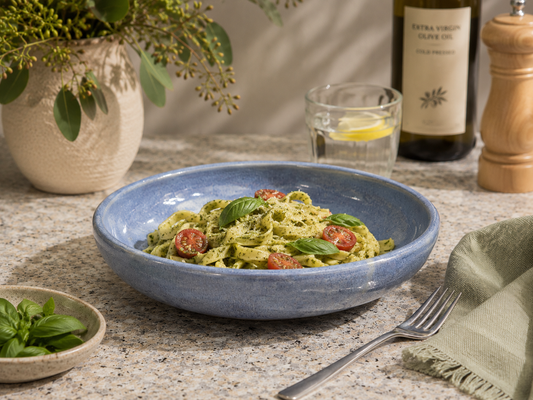 Handmade blue stoneware pasta bowl by Buxton Pottery filled with fresh pesto pasta