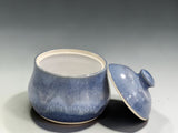 Open blue ceramic sugar bowl showing clean food-safe interior