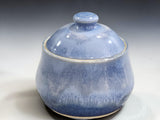 Blue ceramic canister holding approximately two cups of dry ingredients