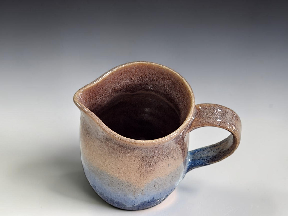 Handmade ceramic milk jug with brown and blue glaze, 300 ml