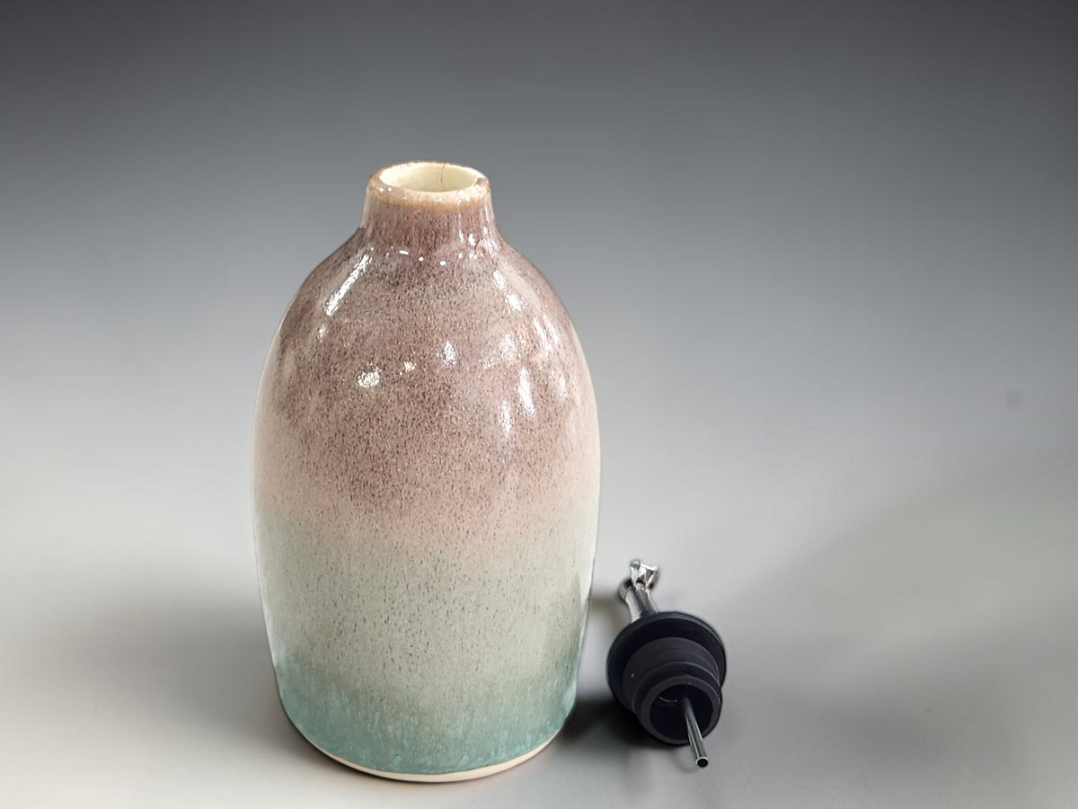 A handmade gift for a chef would suit this oil pourer in green and brown.