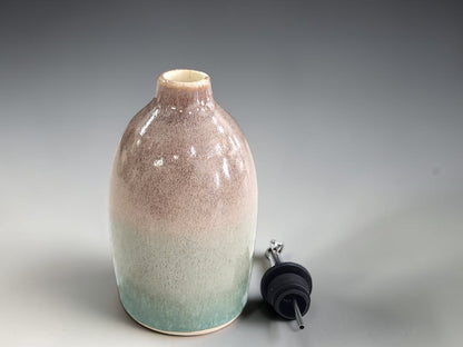 A handmade gift for a chef would suit this oil pourer in green and brown.