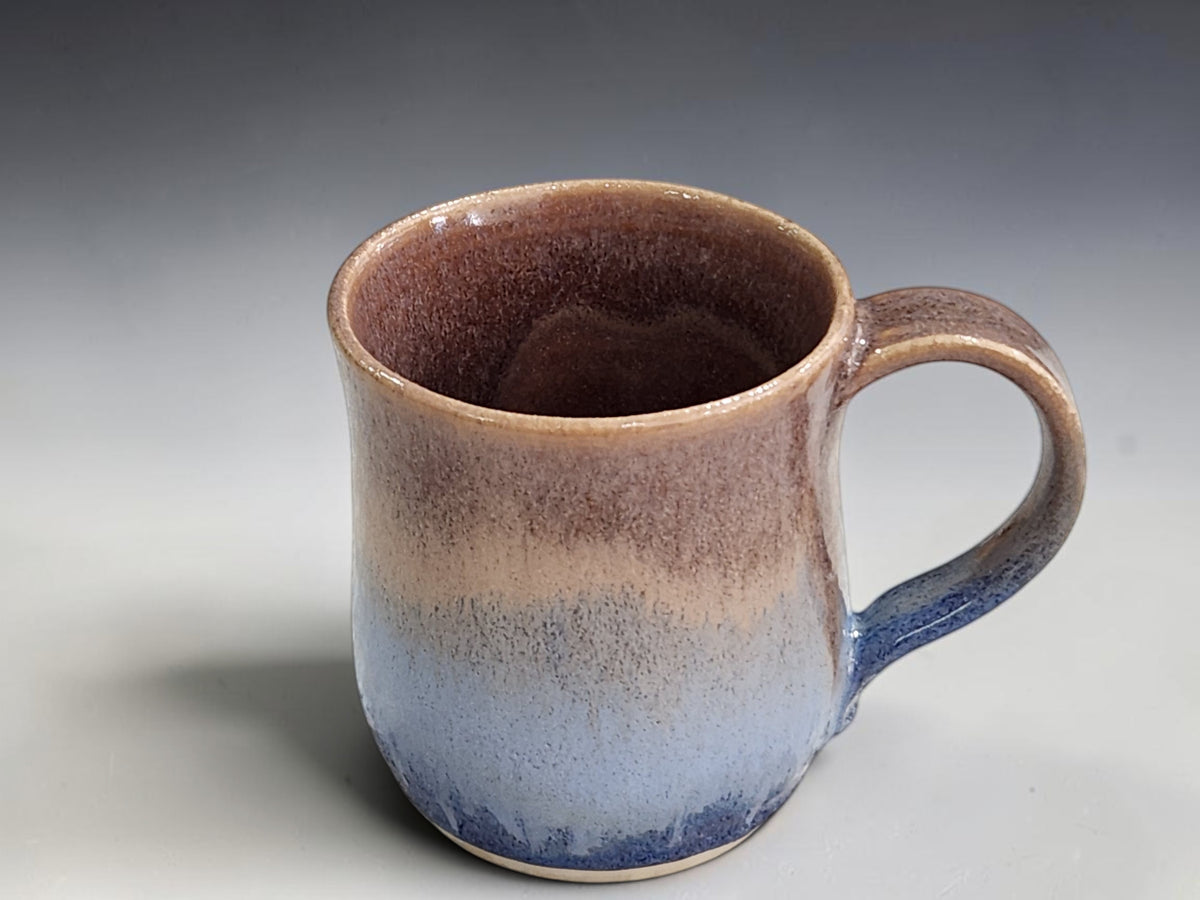 Blue and earthy brown stoneware mug with handcrafted handle