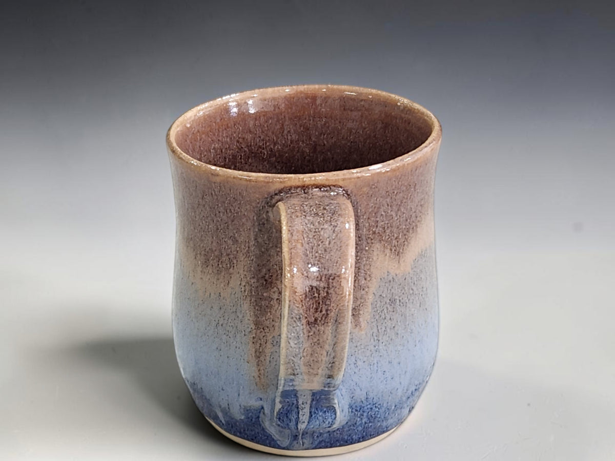 Wheel-thrown 300 ml ceramic mug with deep blue and oatmeal glaze