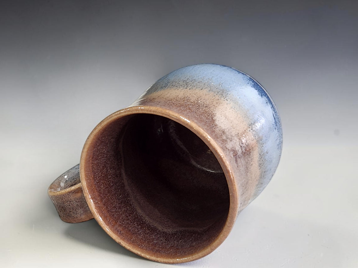 Interior view of 300 ml mug with warm glossy brown glaze