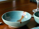 Handmade pottery pasta bowl spearmint green with brown slash