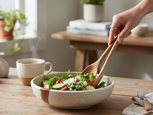 Handmade pottery pasta bowl in speckled cream with brown slash