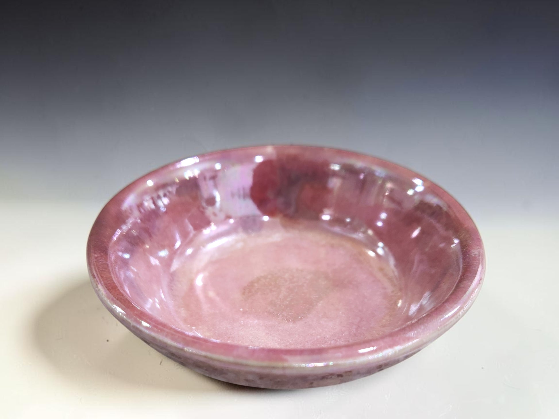 Handmade jewellery dish in pink pottery glaze