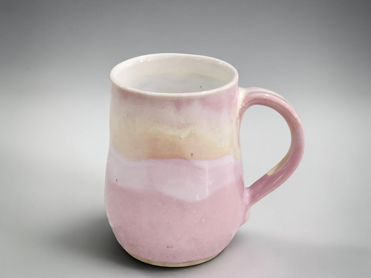 Handmade ceramic mug in soft pink and cream glaze, wheel thrown in Melbourne Australia