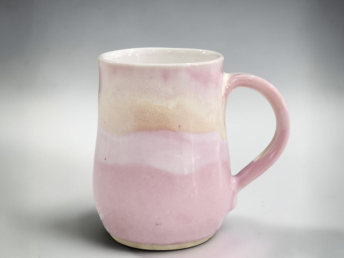 400ml handmade pottery coffee mug with blush pink and flowing cream glaze