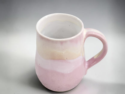 Soft pink handmade stoneware mug with layered cream glaze by Buxton Pottery