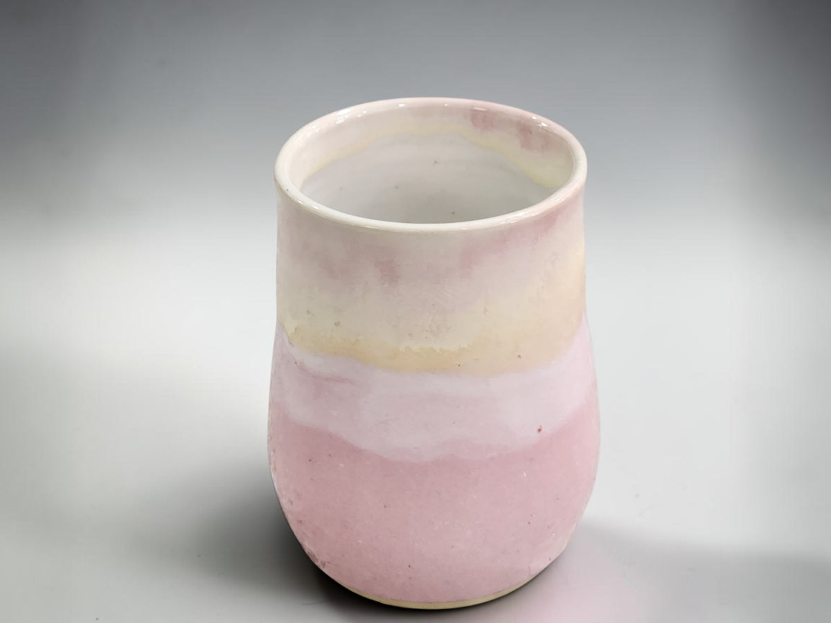 Wheel thrown ceramic mug with pink and creamy white glaze, handmade in Melbourne