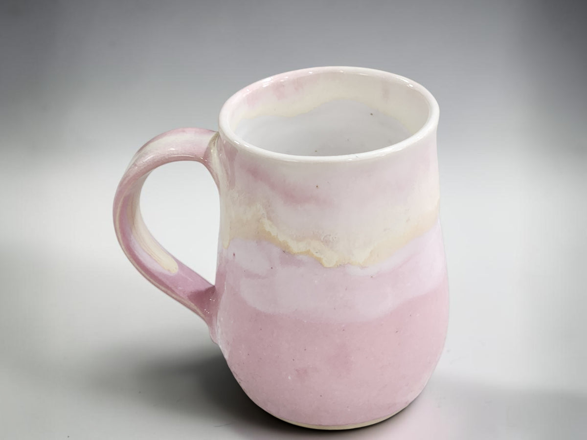 Australian handmade pottery mug in soft blush pink and cream glaze