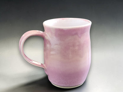 Pink handmade ceramic mug with soft variegated glaze
