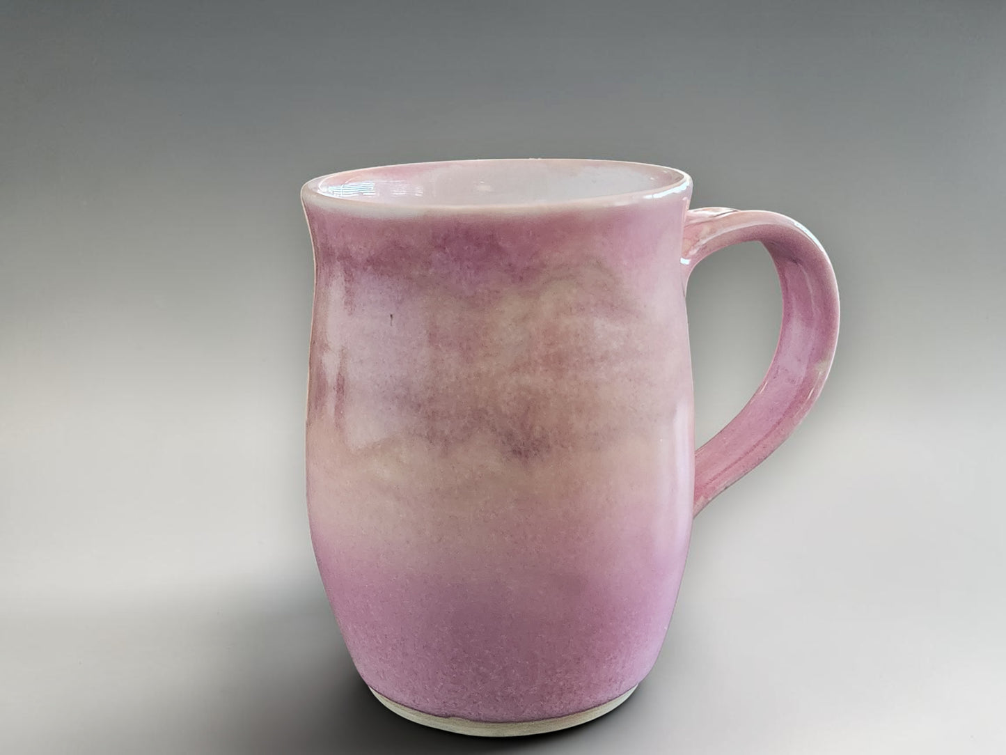 Handmade pottery mug in pink for coffee or tea