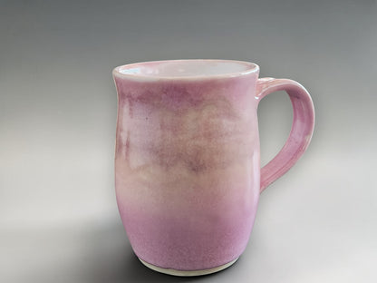 Handmade pottery mug in pink for coffee or tea