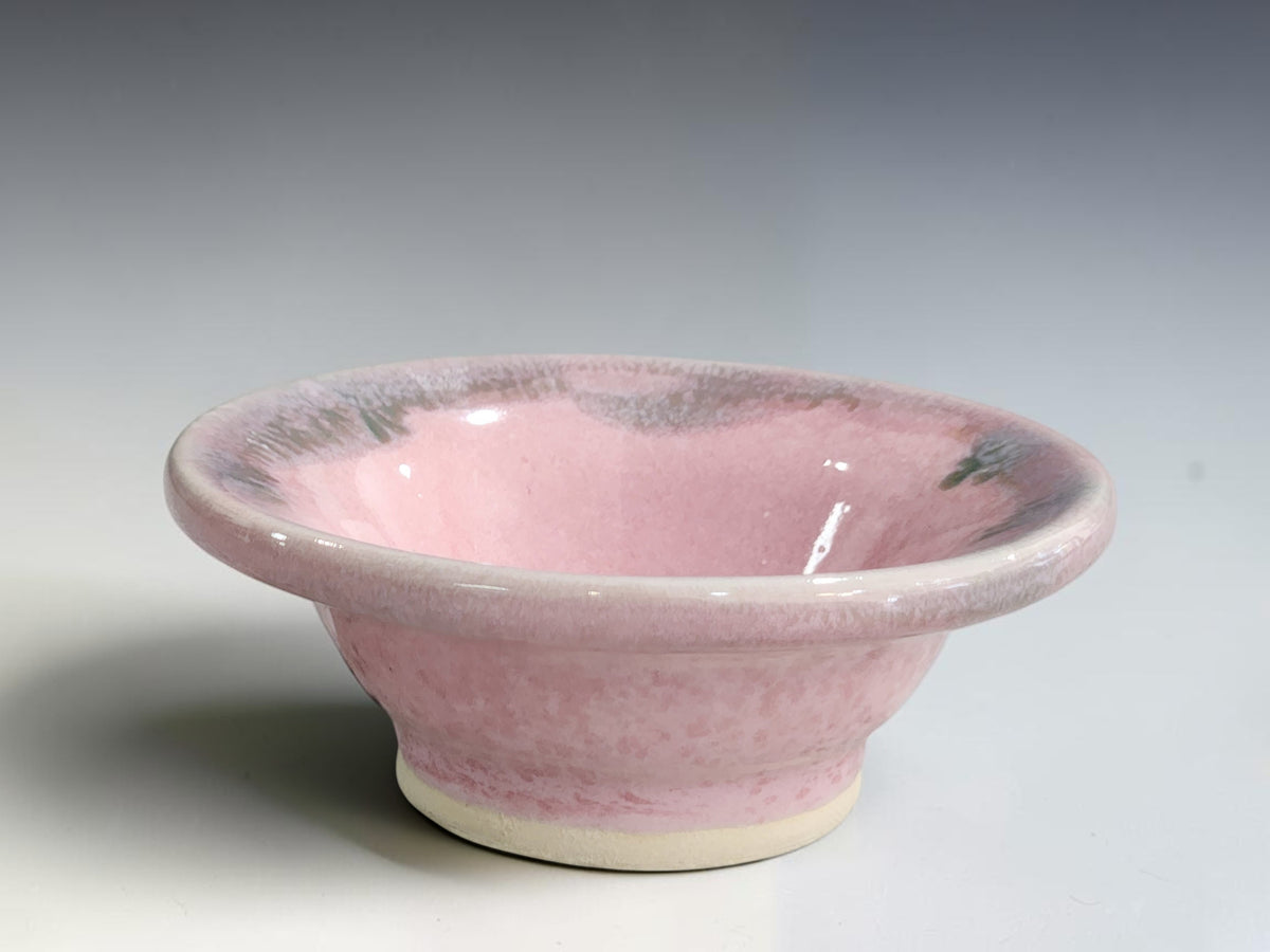 Handmade pink ceramic trinket bowl by Buxton Pottery with a soft grey-lilac rim.