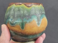 Handmade yunomi in moss green & amber glazes. Crafted in Melbourne, Australia. A unique ceramic cup for tea, coffee, or whisky lovers.
