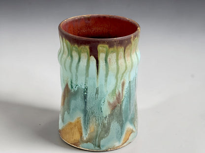 Australian handmade stoneware mug with soft aqua and earthy brown glaze