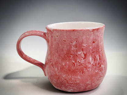 Red crystalline mug with contrasting light glazed interior
