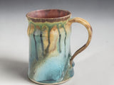 Handmade Australian stoneware mug with flowing rustic glaze inspired by native creek landscapes.