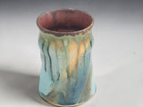 Front view of a one-of-a-kind Bush Creek Earth pottery mug with organic glaze movement.