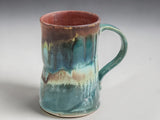 Handmade Australian stoneware mug with comfortable curved handle and unique glaze.