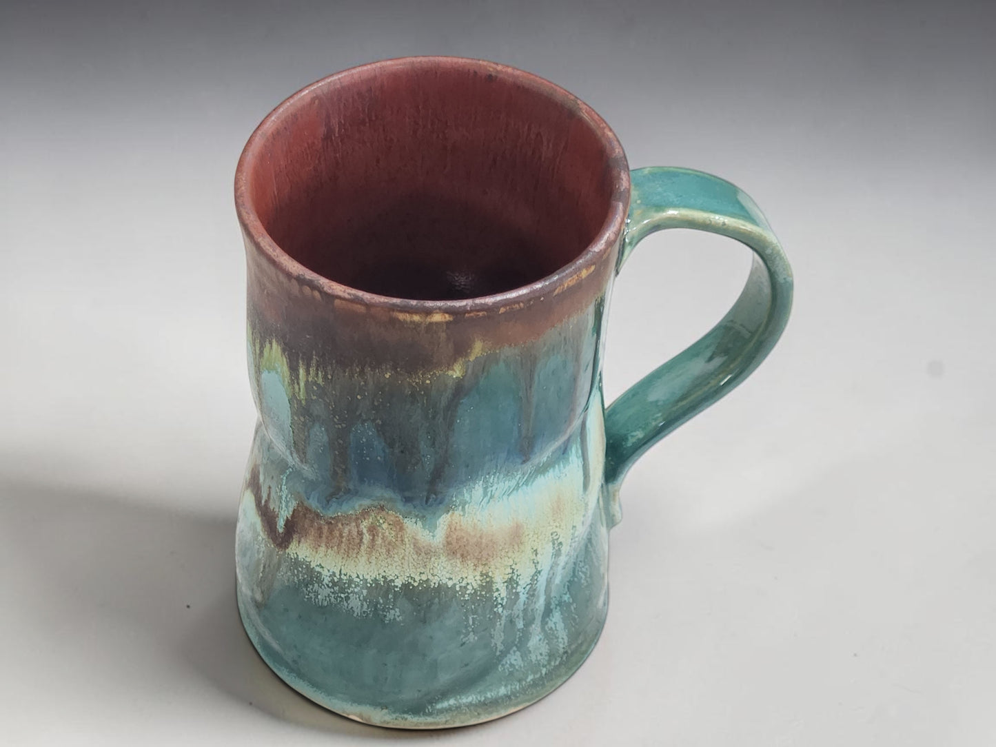 Side view of a handcrafted ceramic coffee mug made in Melbourne, Australia.