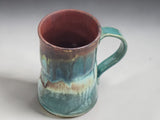 Side view of a handcrafted ceramic coffee mug made in Melbourne, Australia.